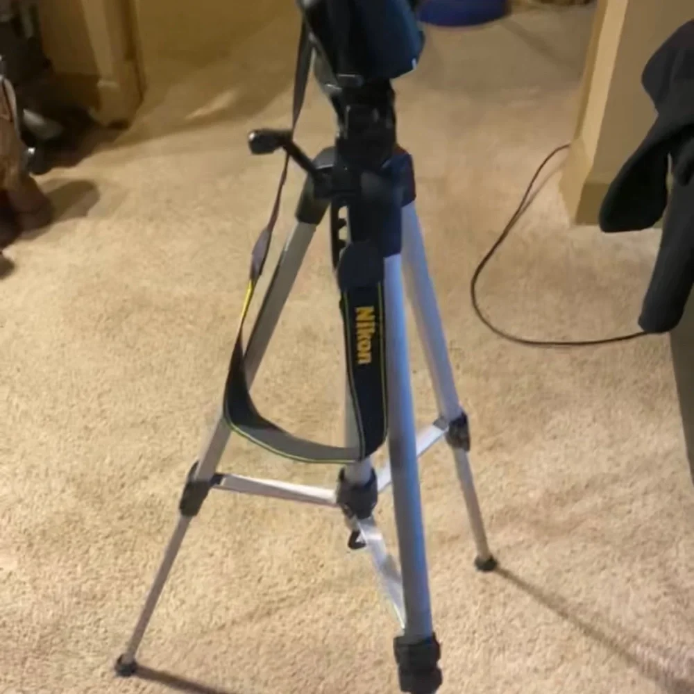 Nikon D3400. Comes with camera, lenses, camera case, battery charger, and tripod
